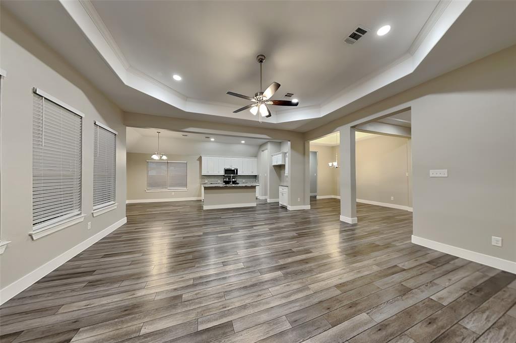 237 Giddings Trail Forney, TX 75126 - Photo 2 of 18 a view of empty room with wooden floor