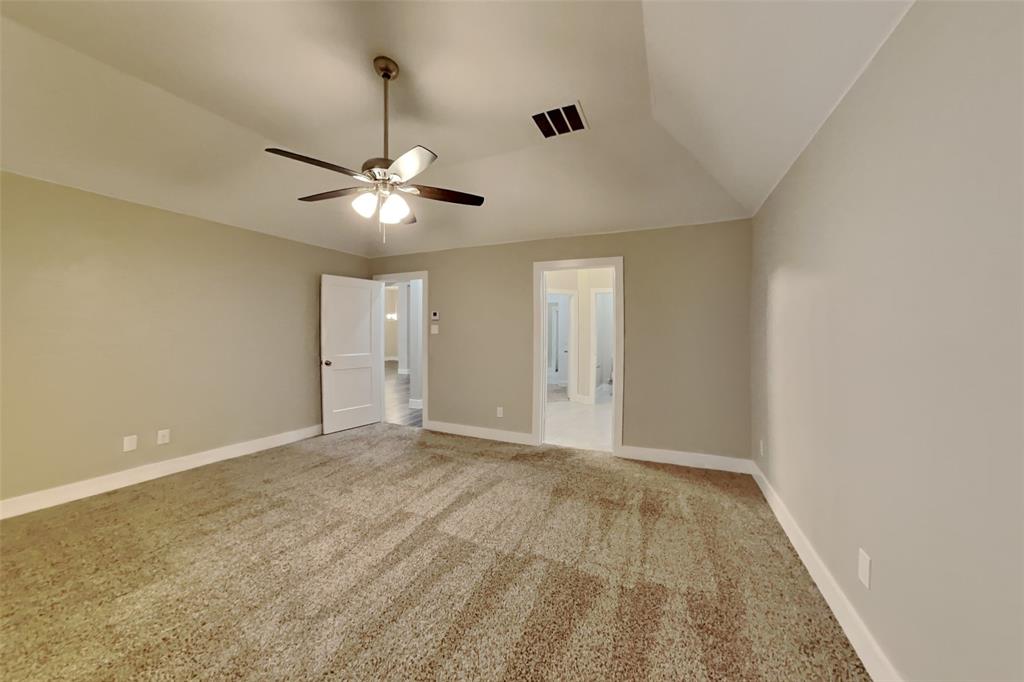 237 Giddings Trail Forney, TX 75126 - Photo 7 of 18 a view of an empty room with a ceiling fan and window