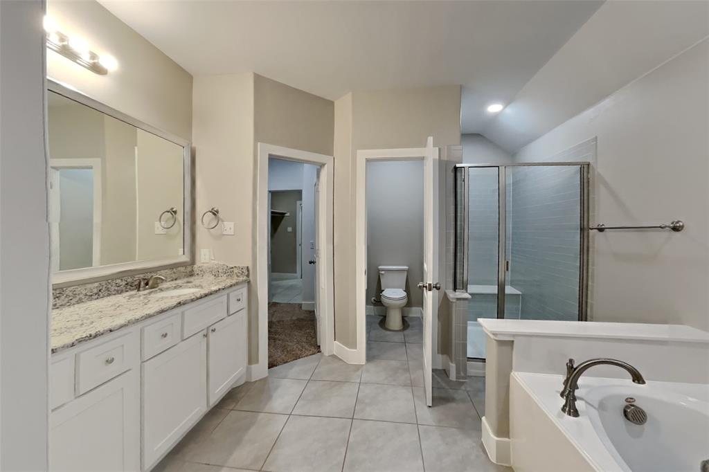 237 Giddings Trail Forney, TX 75126 - Photo 9 of 18 a bathroom with a double vanity sink mirror and shower