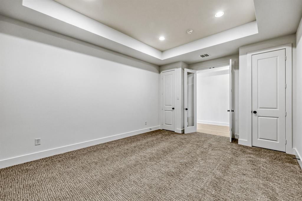 147 Derrett Lane Rhome, TX 76078 - Photo 20 of 28 Unfurnished bedroom featuring a raised ceiling, recessed lighting, and carpet