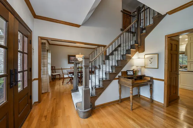 a view of entryway and hall with wooden floor
