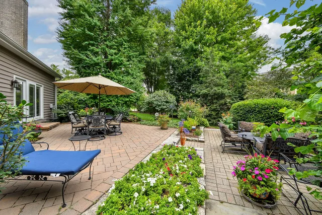 a view of a backyard with sitting area and furniture