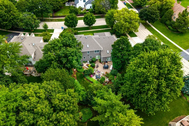 an aerial view of house with yard