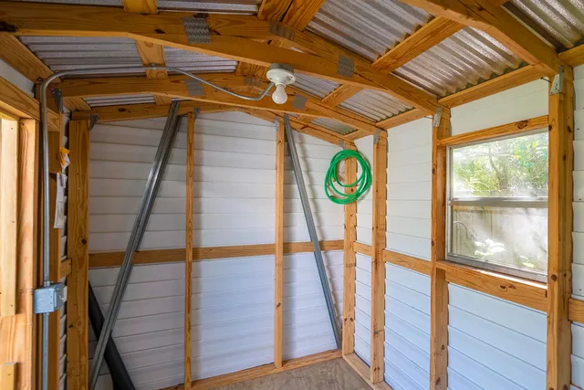 a view of entryway with wooden floor and door