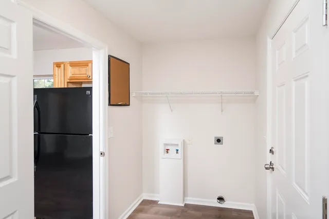 a view of kitchen with a refrigerator
