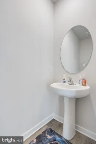 a bathroom with a sink and mirror
