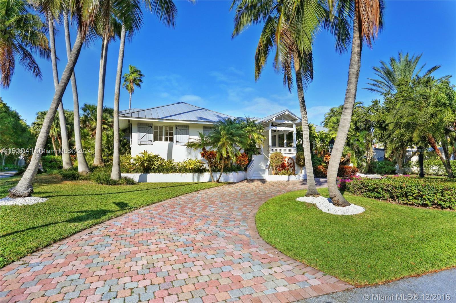 a view of a house with a swimming pool and a patio