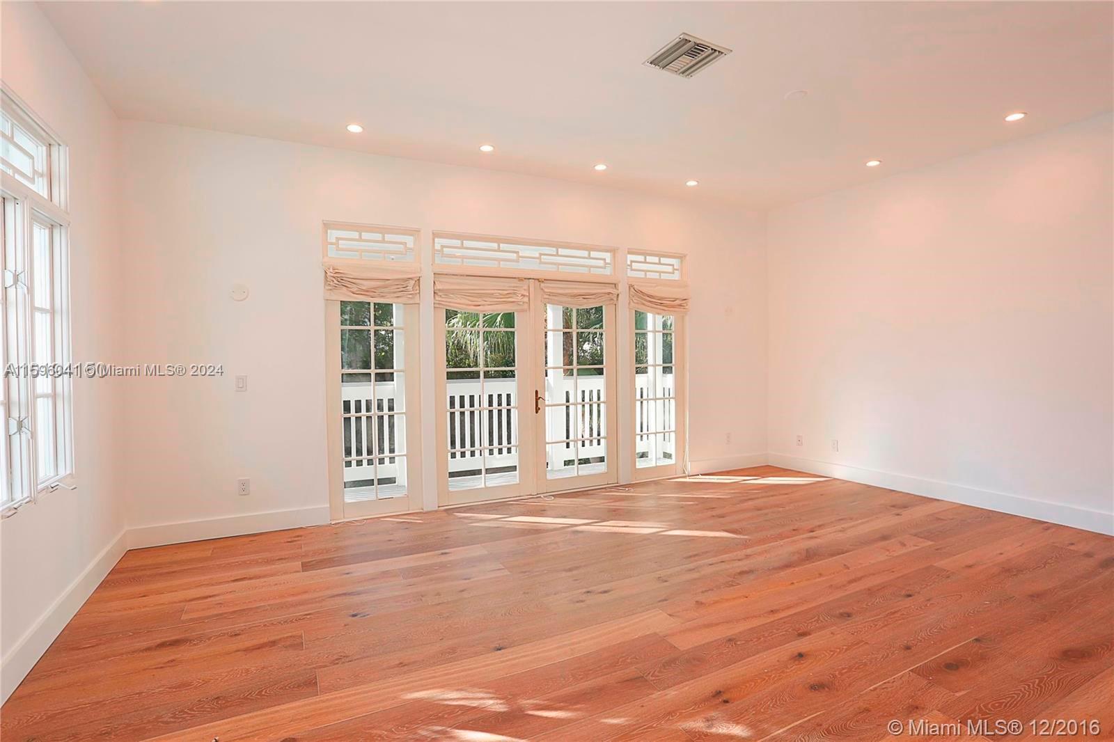 390 Gulf Road Key Biscayne, FL 33149 - Photo 19 of 25 a view of an empty room with a window