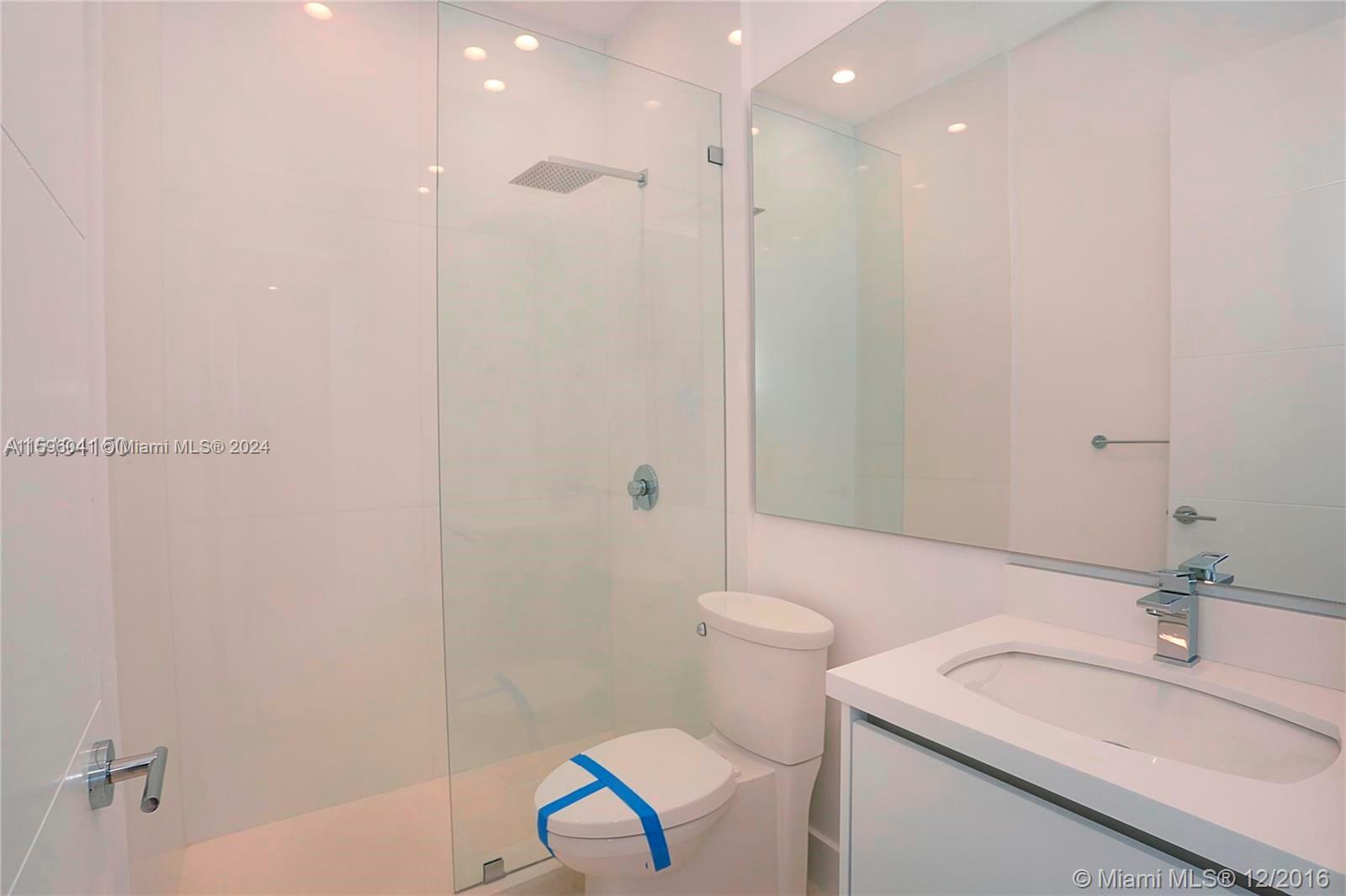 390 Gulf Road Key Biscayne, FL 33149 - Photo 25 of 25 a bathroom with a sink a toilet and shower