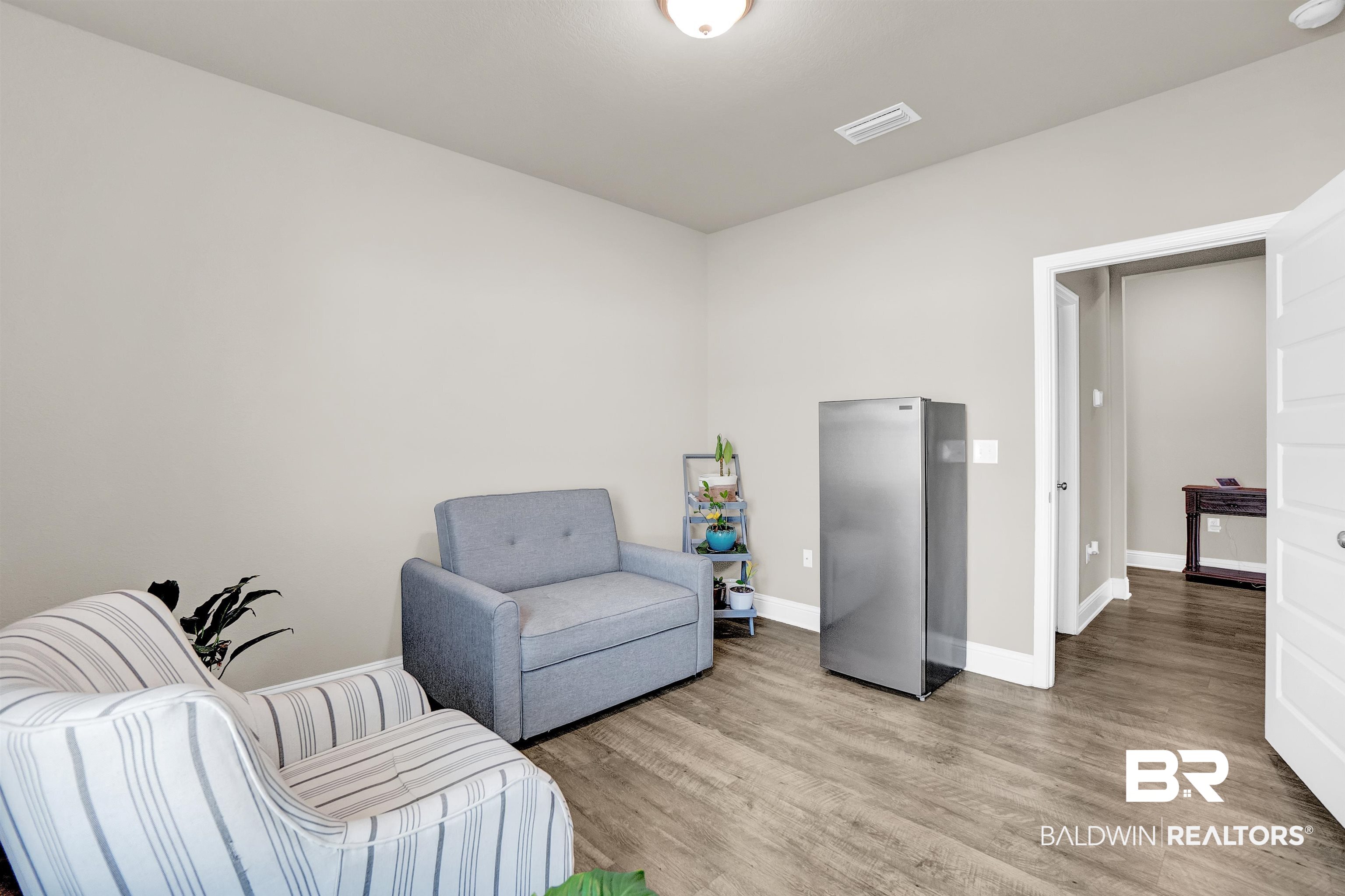31671 Memphis Loop Daphne, AL 36527 - Photo 16 of 51 Sitting room featuring baseboards, visible vents, and light wood-style floors