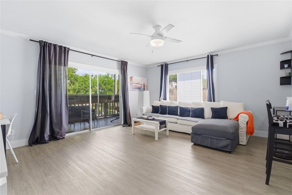631 North Keene Road, Unit S8 Clearwater, FL 33755 - Photo 11 of 20 a living room with furniture and a large window