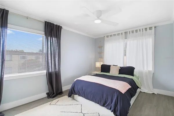 a bedroom with a bed and a cabinets