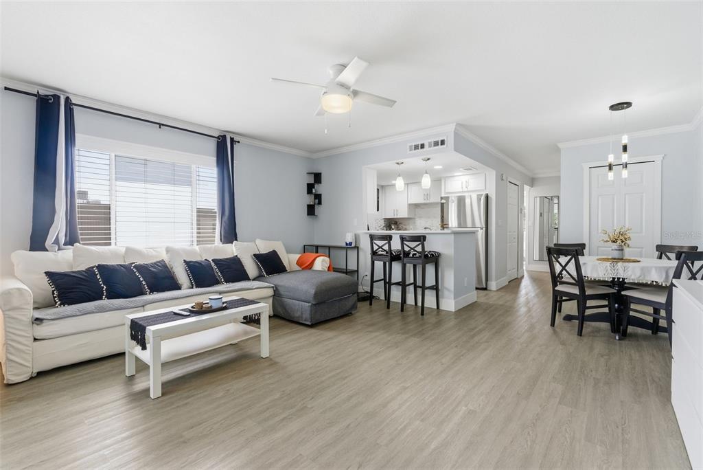 631 North Keene Road, Unit S8 Clearwater, FL 33755 - Photo 12 of 20 a living room with furniture and kitchen view