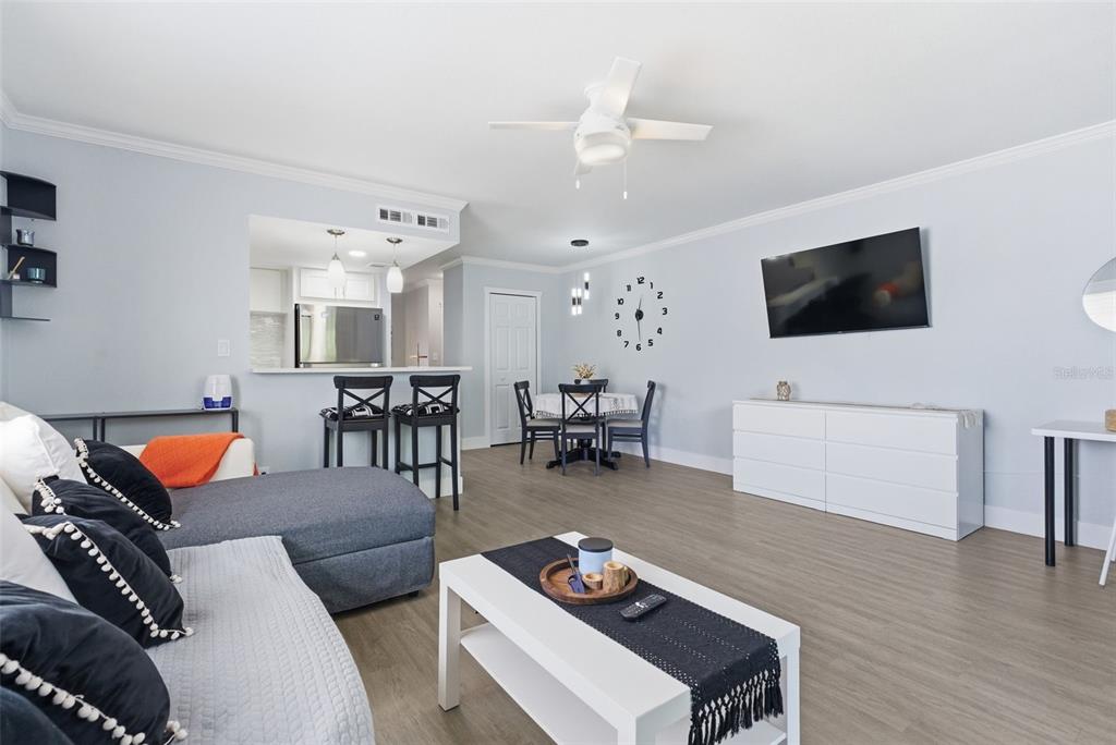 631 North Keene Road, Unit S8 Clearwater, FL 33755 - Photo 13 of 20 a living room with furniture and a flat screen tv