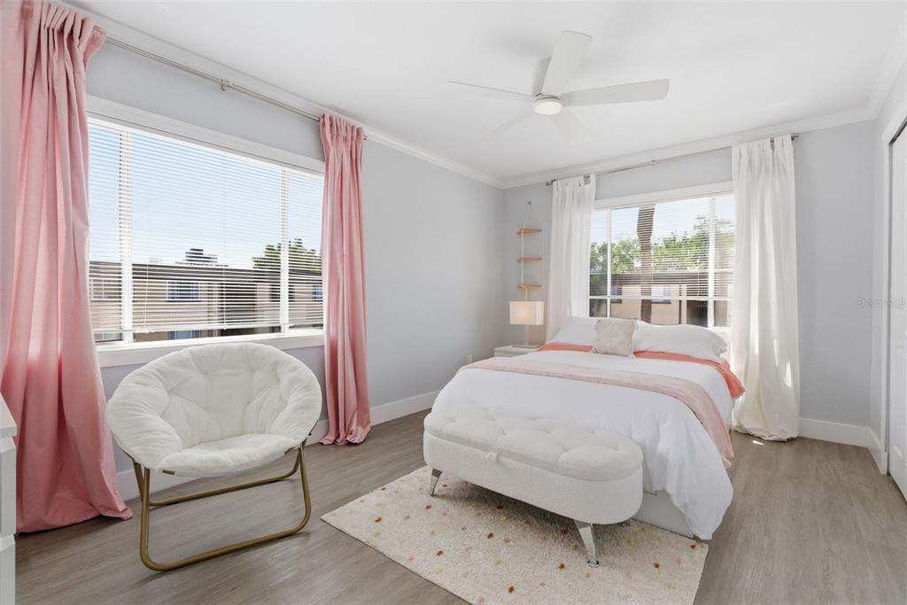 631 North Keene Road, Unit S8 Clearwater, FL 33755 - Photo 16 of 20 a bedroom with a bed and a large window