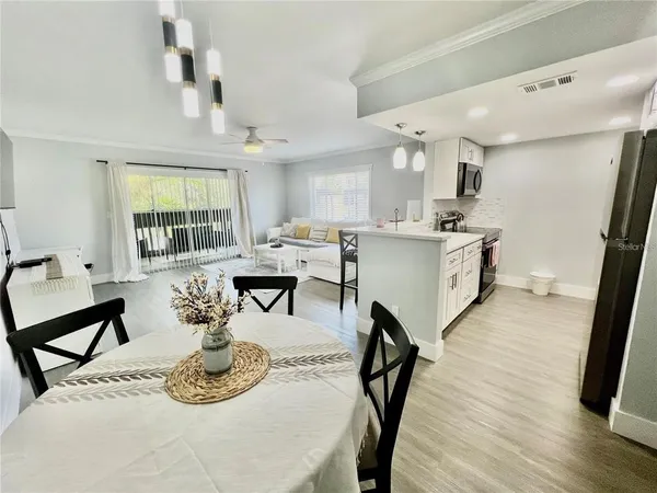 a kitchen with a sink appliances and cabinets