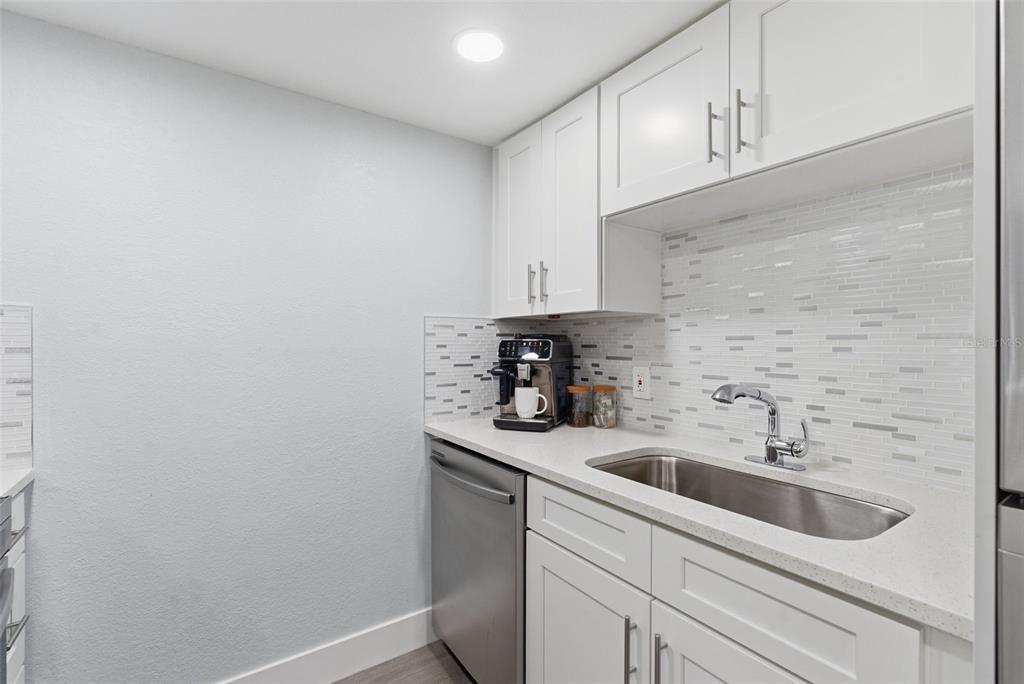 631 North Keene Road, Unit S8 Clearwater, FL 33755 - Photo 6 of 20 a kitchen with a sink and cabinets