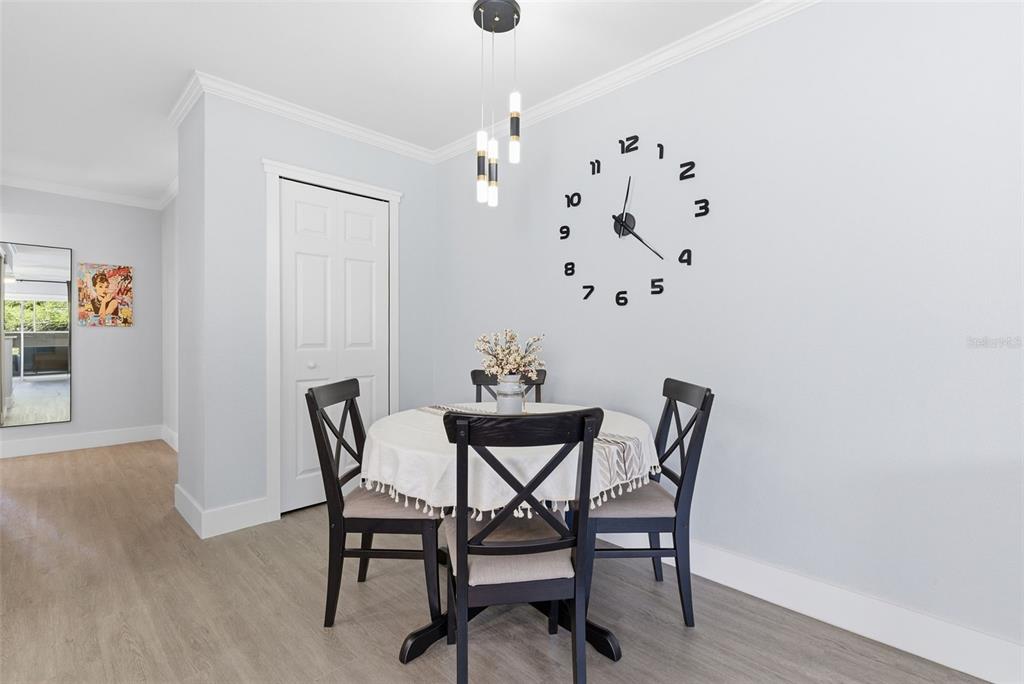 631 North Keene Road, Unit S8 Clearwater, FL 33755 - Photo 10 of 20 a view of a dining room with furniture and wooden floor