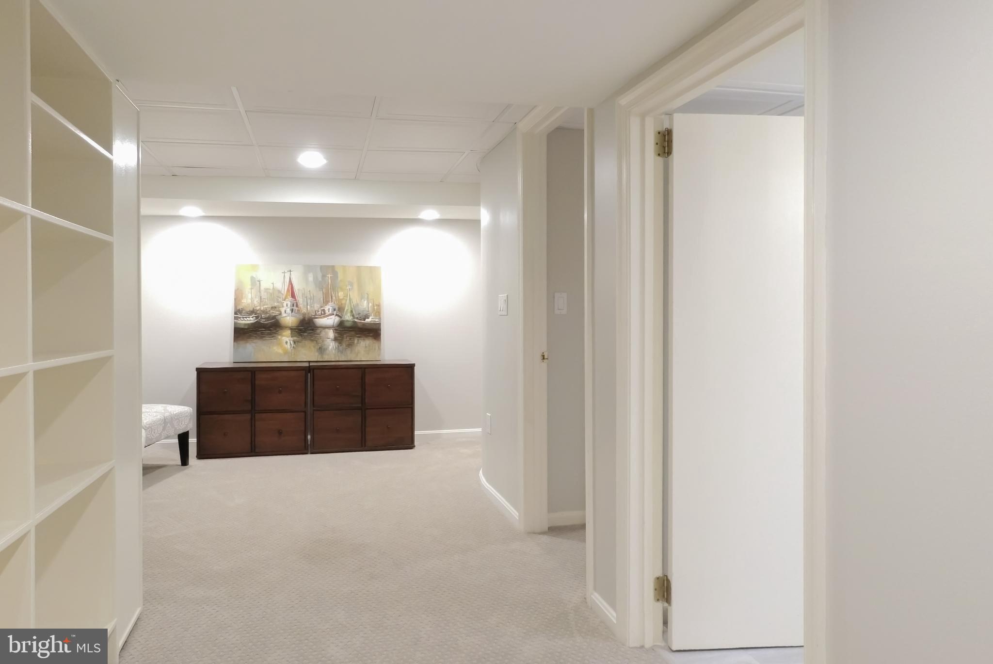 5908 Gloster Road Bethesda, MD 20816 - Photo 28 of 40 Lower level view towards Den/potential Bedroom #4