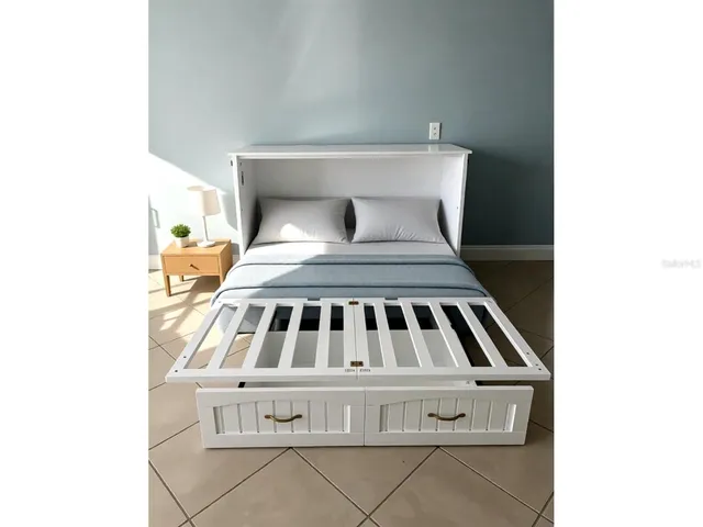 a bedroom with a bed and a rug