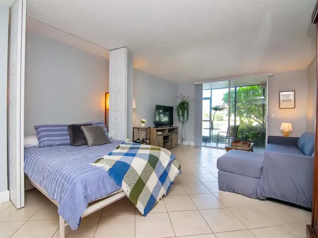 a view of a balcony with chair table and chairs