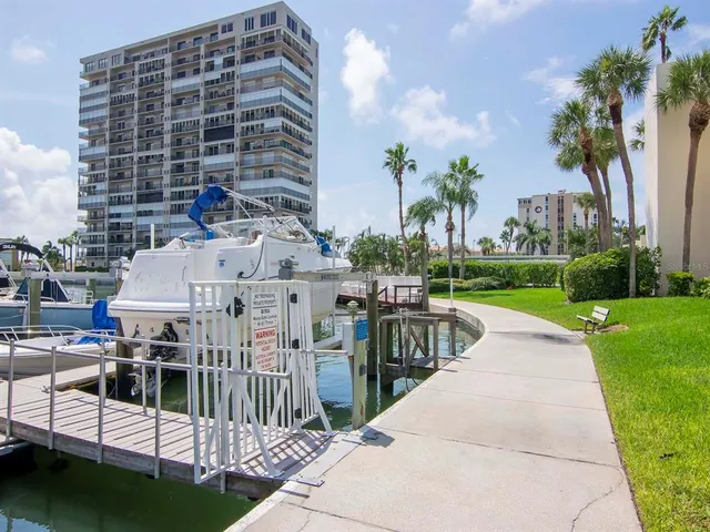 a view of a room with furniture and wooden floor