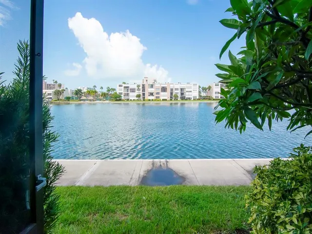 a view of a lake with a yard