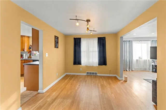 a view of a livingroom with wooden floor