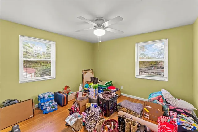 a bedroom with furniture and a window