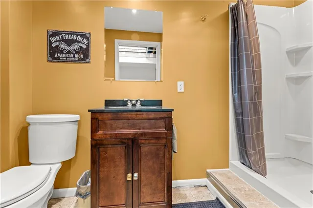 a bathroom with a toilet and a sink