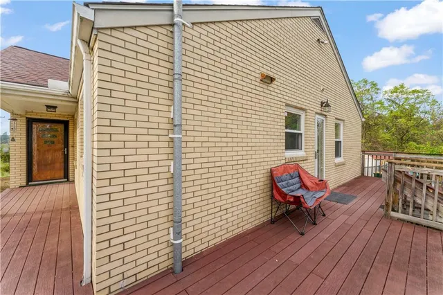 a view of a balcony with chairs