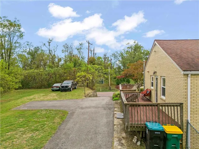 a view of an outdoor space with a patio and swimming pool