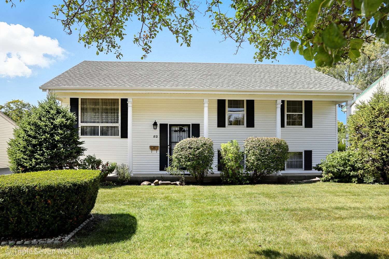 front view of a house with a yard