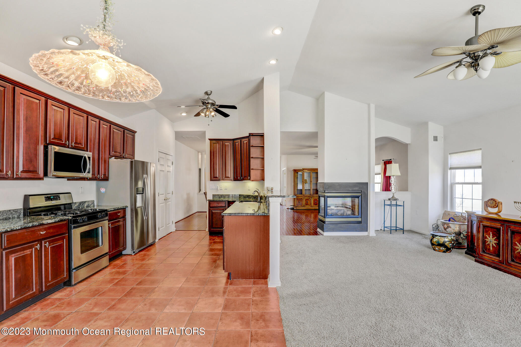 12 Vecchio Road Manchester Township, NJ 08759 - Photo 12 of 35 a view of a living room kitchen and a chandelier
