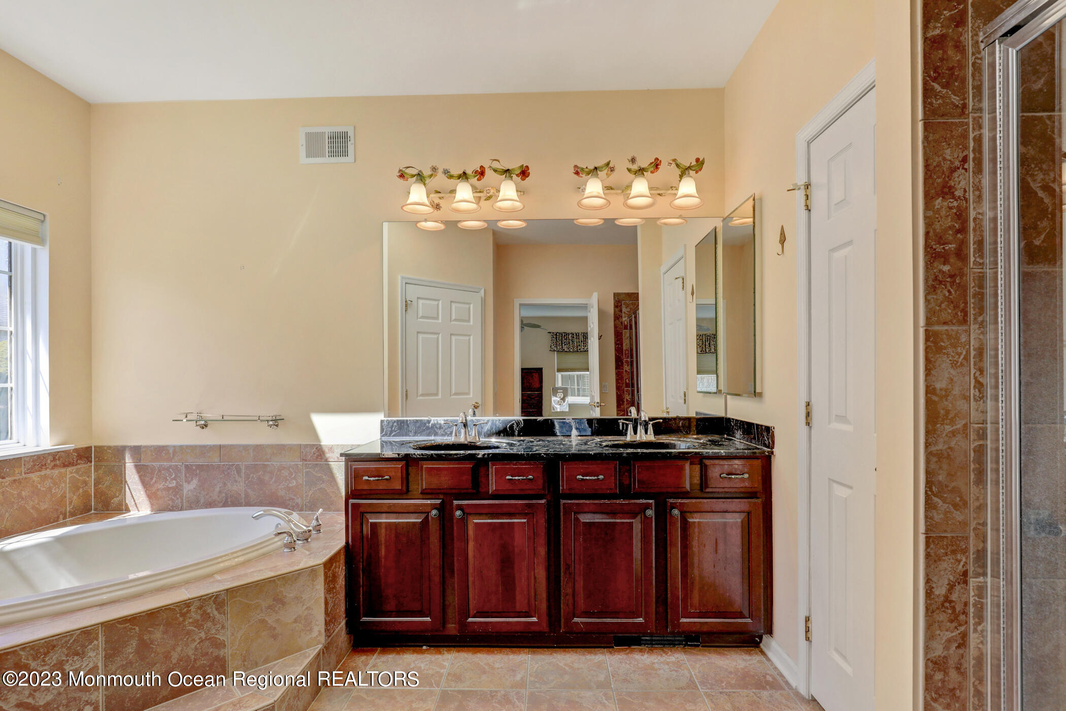 12 Vecchio Road Manchester Township, NJ 08759 - Photo 21 of 35 a spacious bathroom with a granite countertop sink a mirror and a bathtub