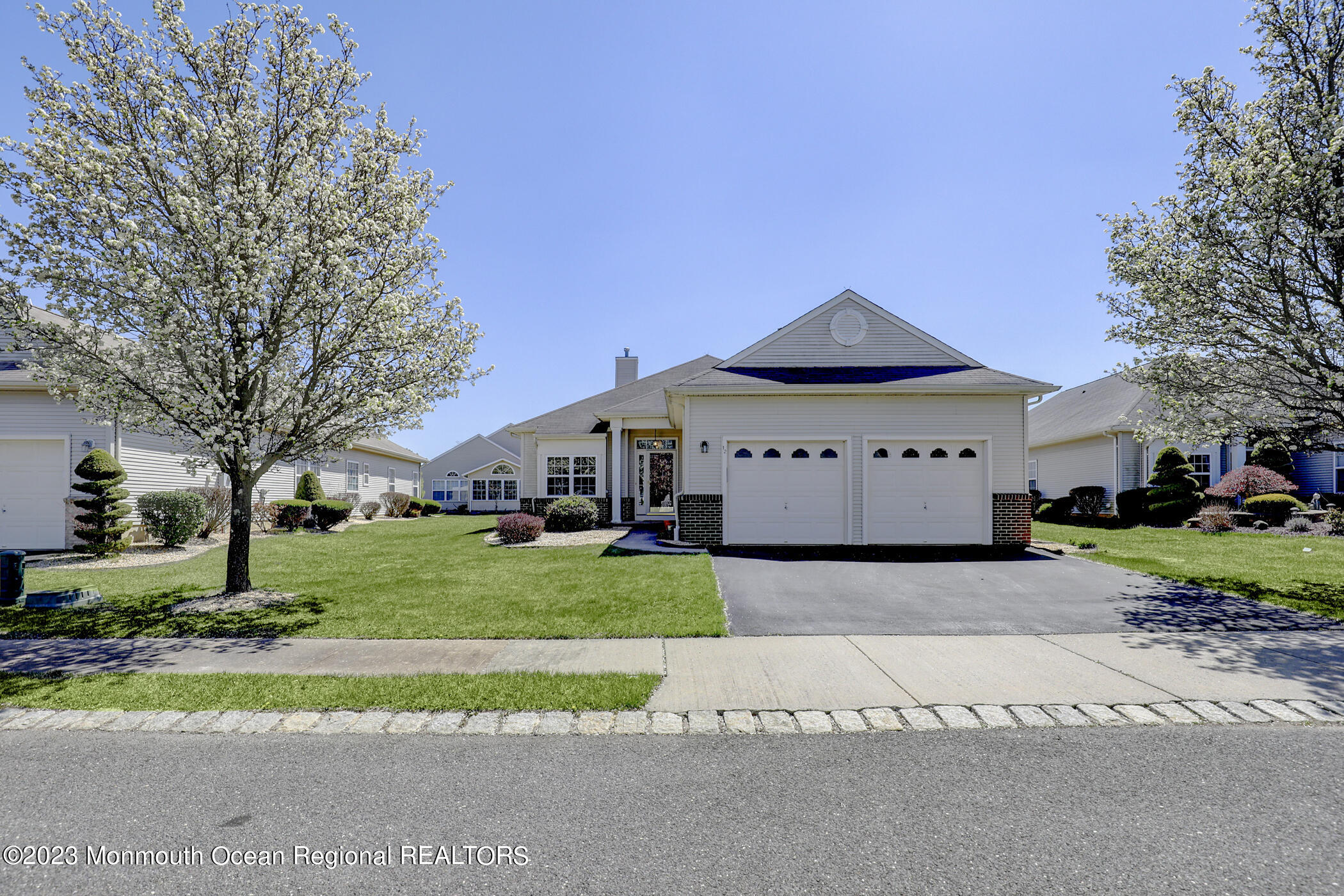 12 Vecchio Road Manchester Township, NJ 08759 - Photo 3 of 35 a front view of a house with a yard and garage