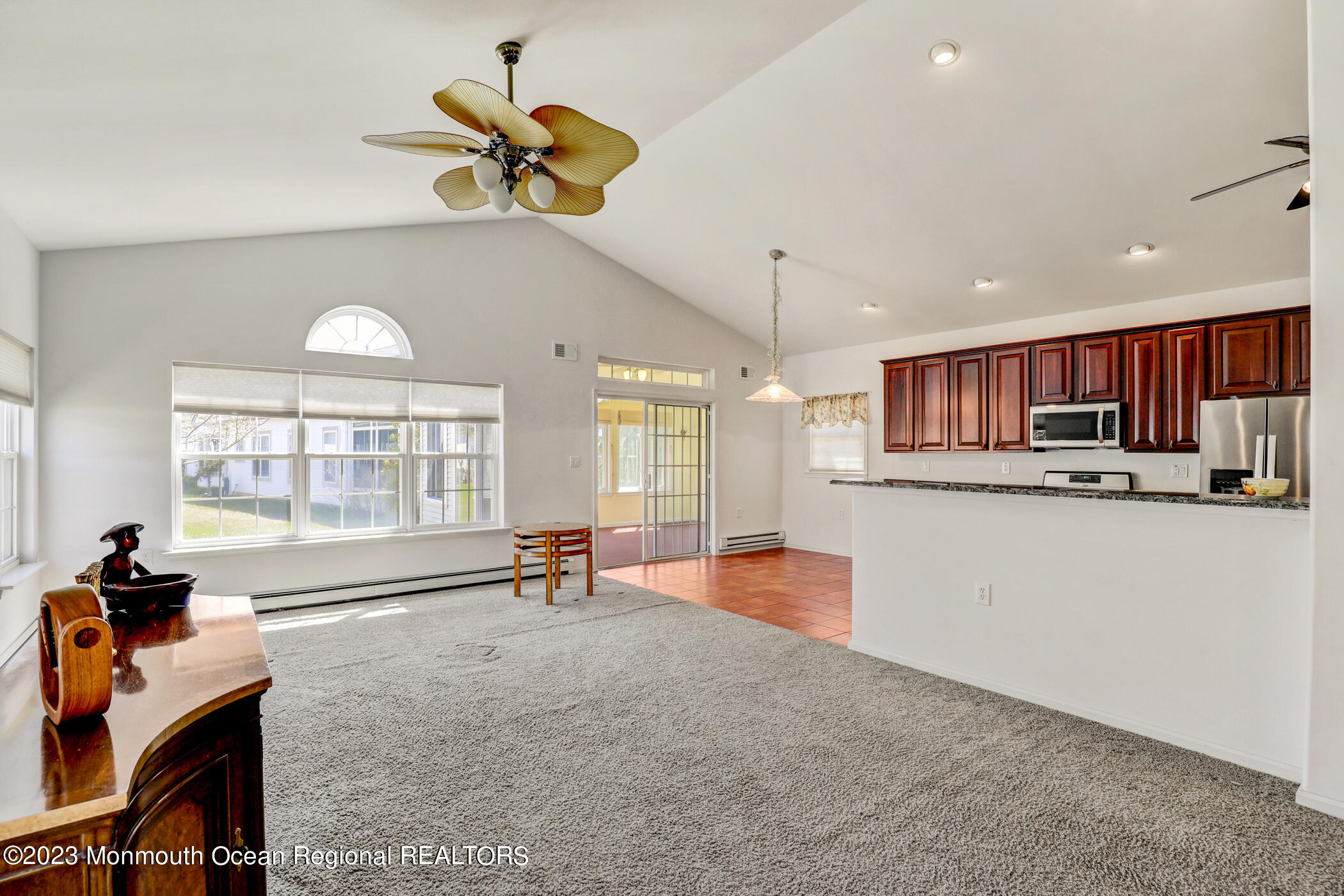 12 Vecchio Road Manchester Township, NJ 08759 - Photo 8 of 35 a living room with stainless steel appliances furniture a chandelier and a kitchen view