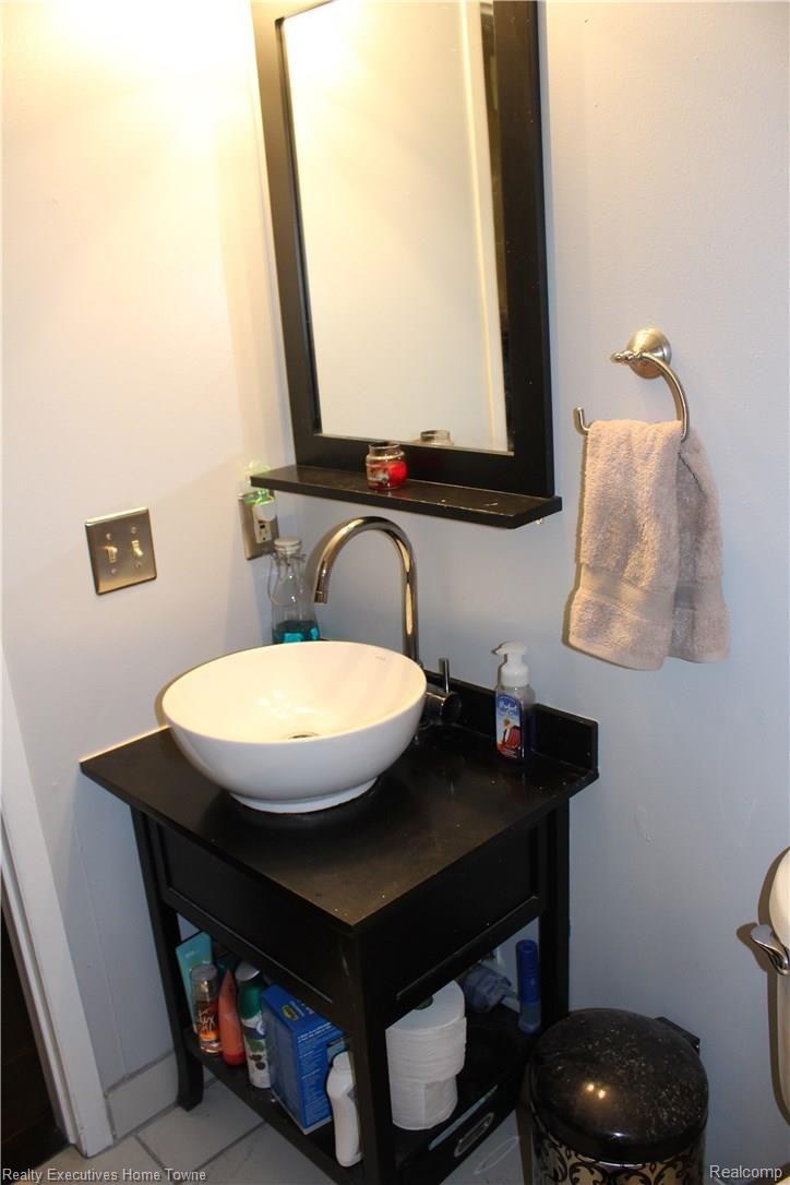 1610 O'Neil Circle Rochester, MI 48307 - Photo 27 of 49 Updated sink, mirror and cabinet.