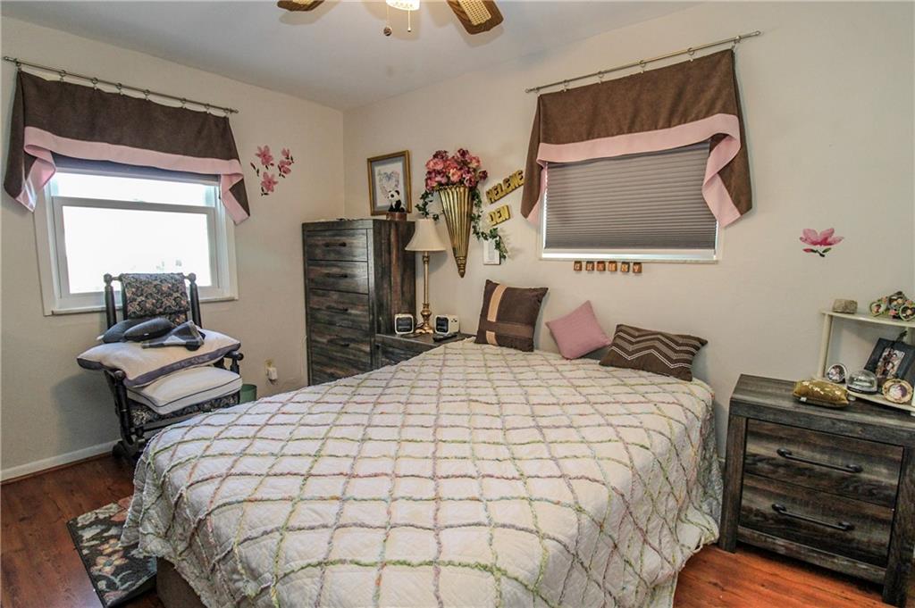 303 Wright Street McKees Rocks, PA 15136 - Photo 13 of 25 First floor bedroom with ceiling fan for added comfort.