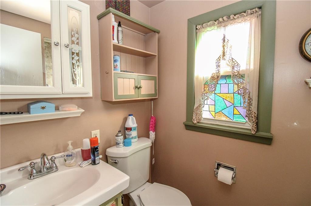 303 Wright Street McKees Rocks, PA 15136 - Photo 17 of 25 Ful bathroom on the upper level with pedestal sink & walk-in shower.