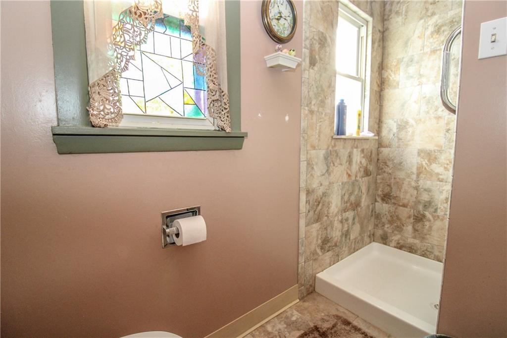 303 Wright Street McKees Rocks, PA 15136 - Photo 18 of 25 Walk-in shower with ceramic tile surround.