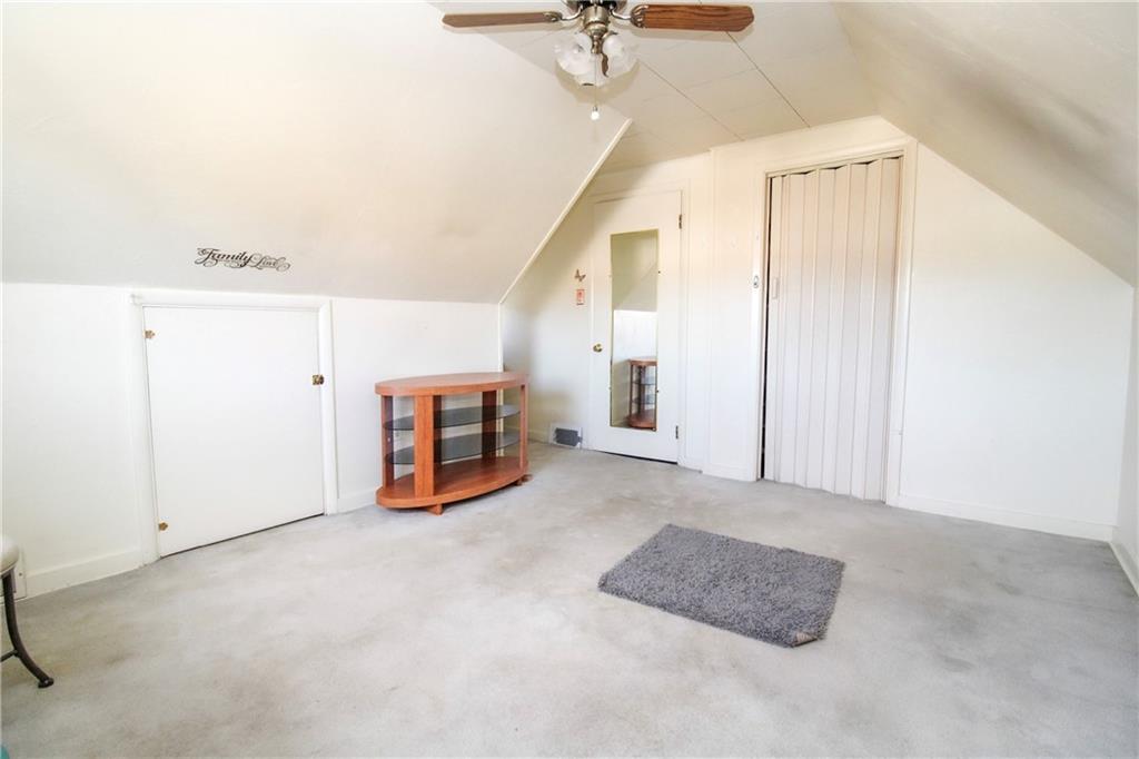 303 Wright Street McKees Rocks, PA 15136 - Photo 19 of 25 Another spacious secondary bedroom on the upper level with neutral tones & ceiling fan.
