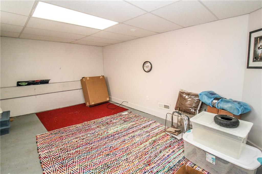 303 Wright Street McKees Rocks, PA 15136 - Photo 21 of 25 Partially finished basement plus large additional unfinished space in the basement for extra storage!