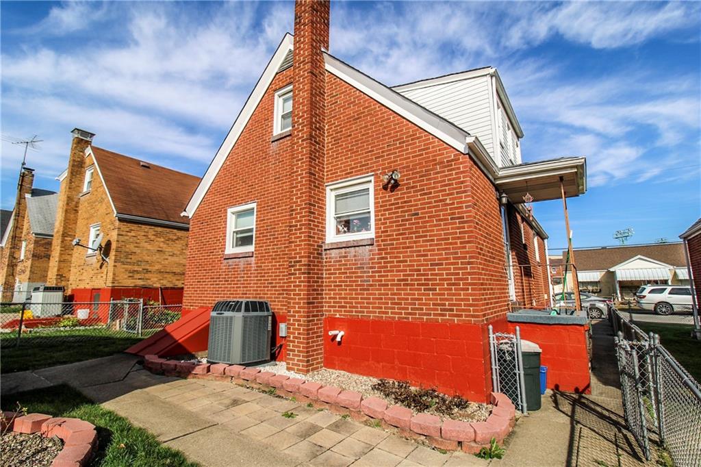 303 Wright Street McKees Rocks, PA 15136 - Photo 23 of 25 Covered side porch with steps lead to the backyard & patio.