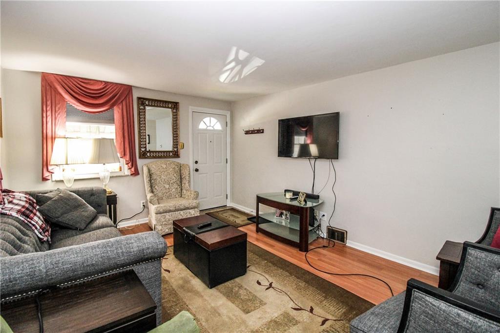 303 Wright Street McKees Rocks, PA 15136 - Photo 5 of 25 Enter into the Living room with neutral tones & filled with natural light!