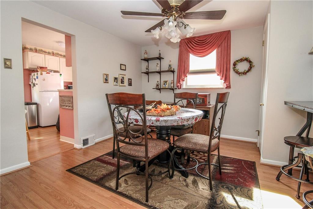303 Wright Street McKees Rocks, PA 15136 - Photo 7 of 25 Formal Dining room off of the Kitchen with ceiling fan.