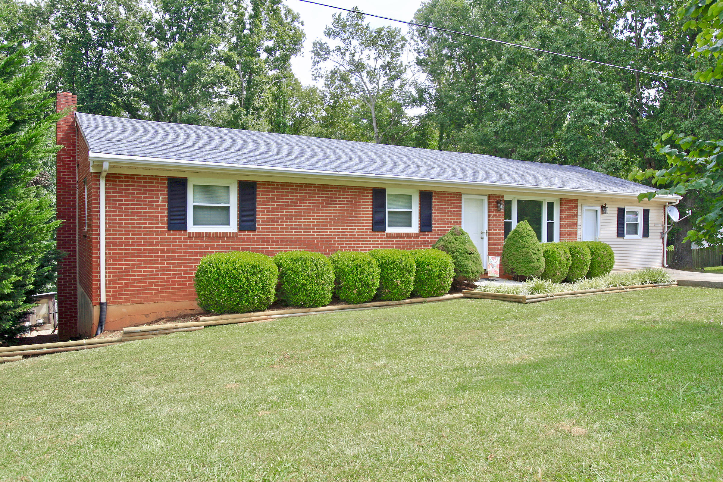 2960 Eton Road Hardy, VA 24101 - Photo 1 of 43 a front view of a house with a yard and trees