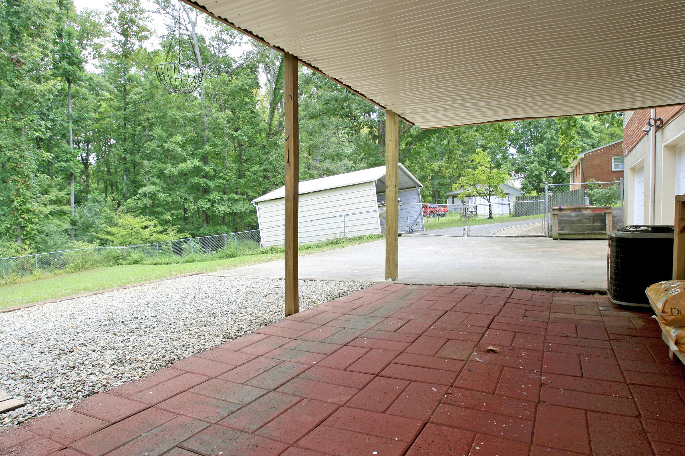 2960 Eton Road Hardy, VA 24101 - Photo 32 of 43 a backyard of a house with yard and outdoor seating