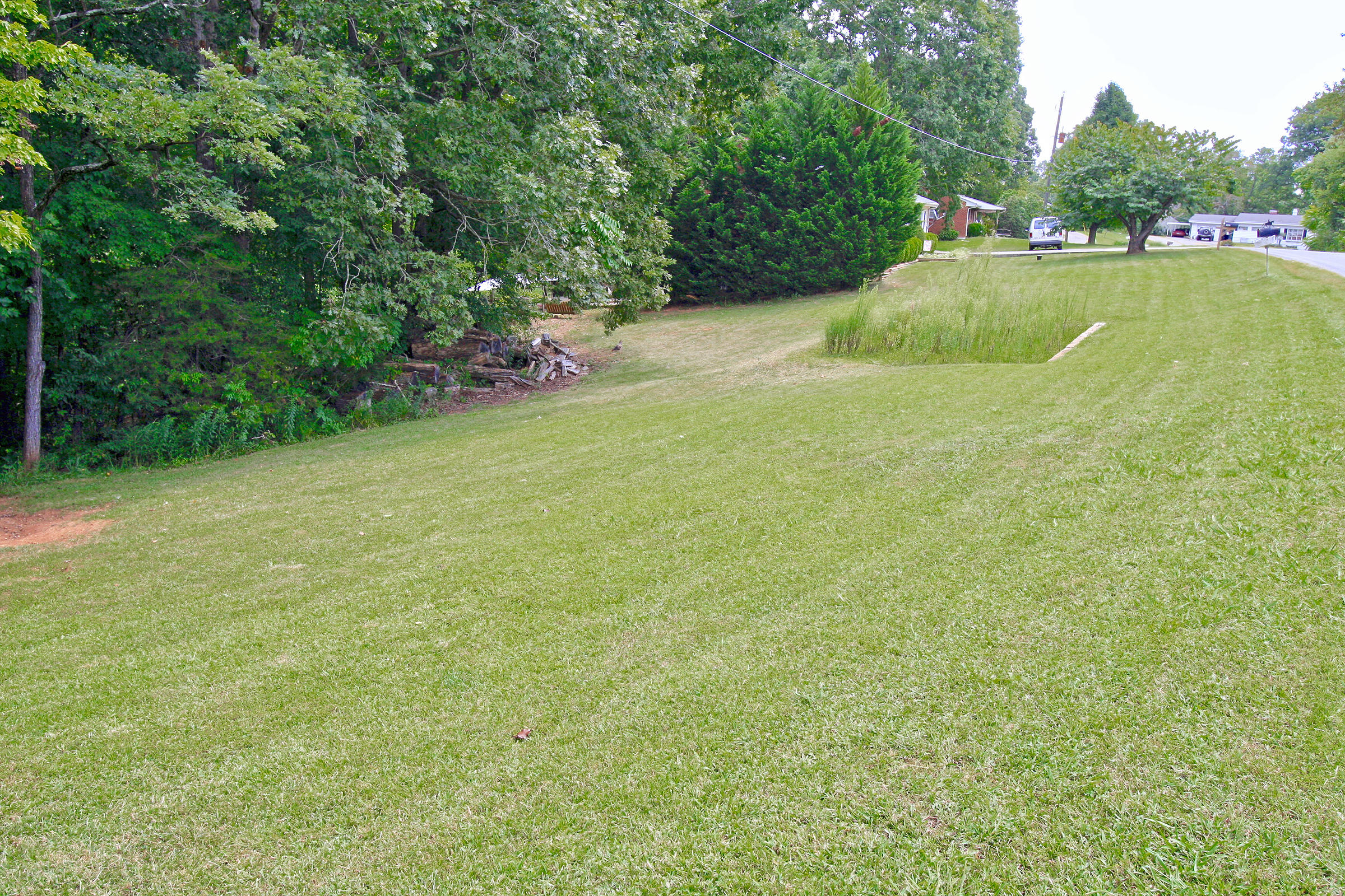 2960 Eton Road Hardy, VA 24101 - Photo 40 of 43 a view of a garden with a bench