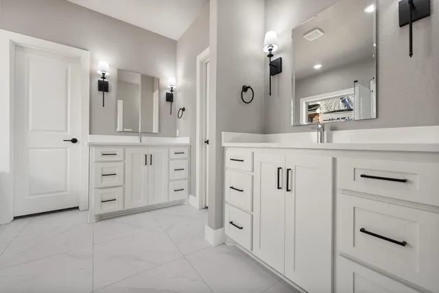 a spacious bathroom with a shower and a sink